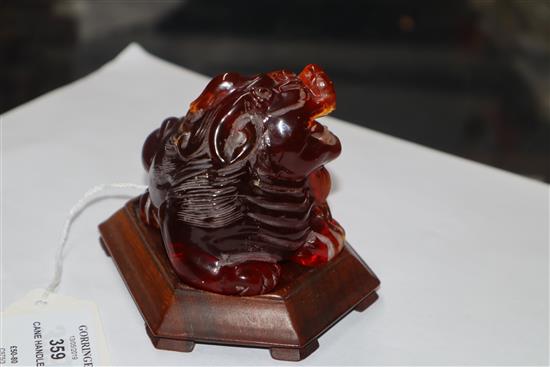 A Japanese ivory cane handle, a faux amber lion-dog and an enamel and ivory pill box